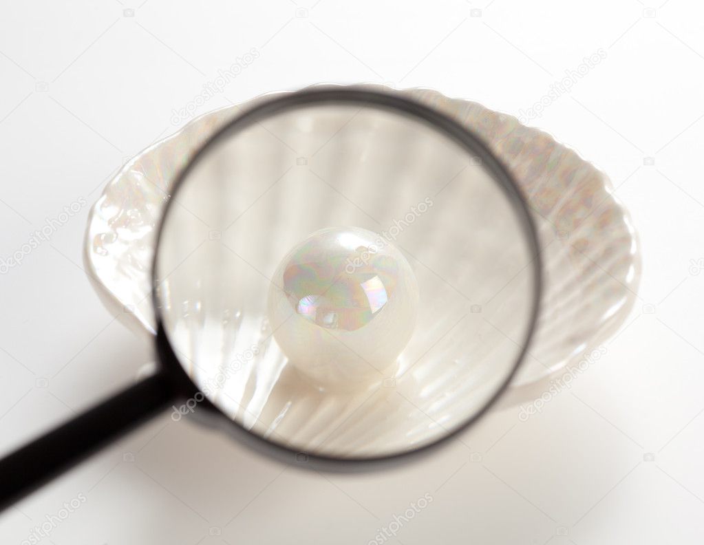 Pearl under magnifying glass