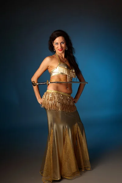 Belly dancer holding a sword on her side — Stock Photo, Image
