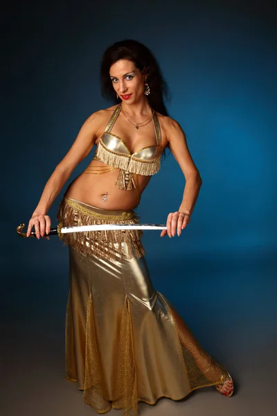 Belly dancer holding a sword — Stock Photo, Image