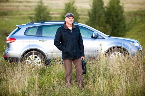 Man and car as the background — Stock Photo, Image