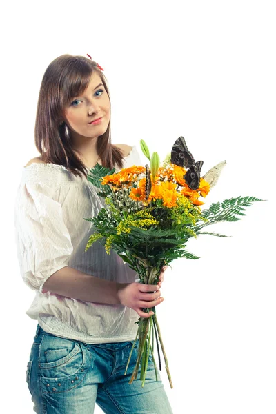 Schönes Mädchen mit einem Blumenstrauß — Stockfoto