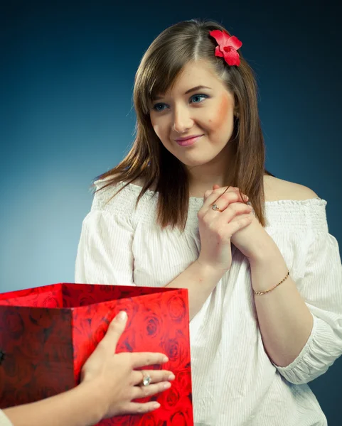 stock image Beautiful girl receives opened gift box