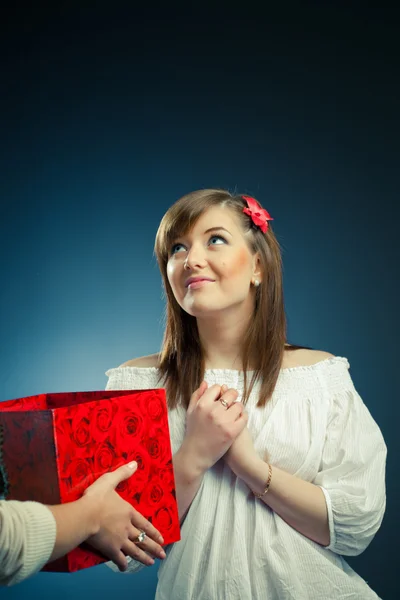 Stock image Beautiful girl receives opened gift box