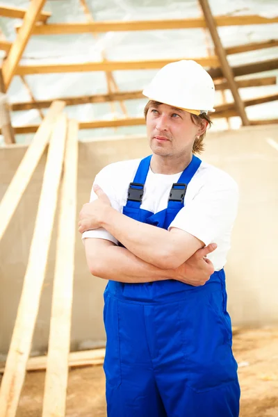 Builder looking at the construction project — Stock Photo, Image