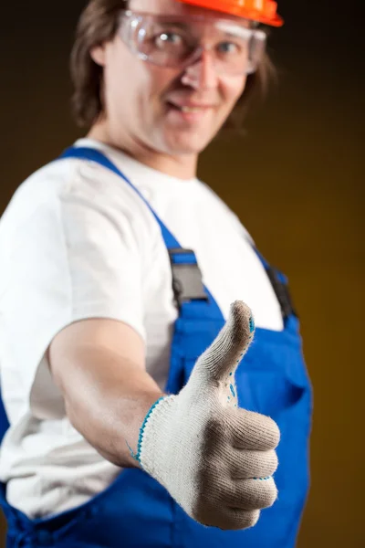 Robotnik budowlany, trzymając kciuki — Zdjęcie stockowe