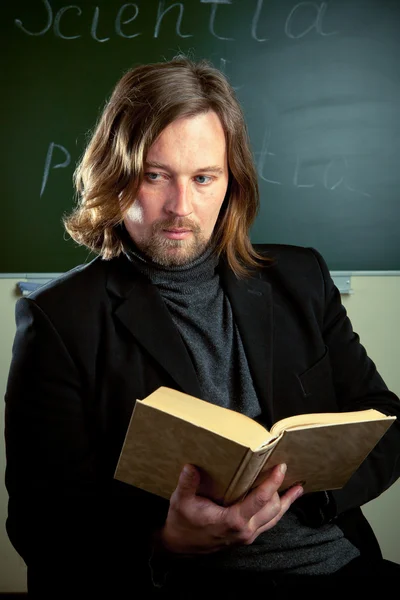Professor reading a book — Stock Photo, Image