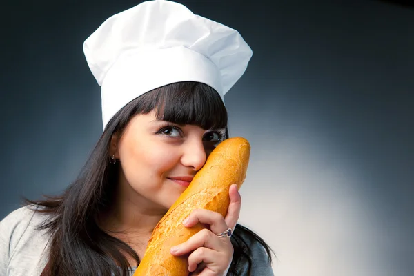 Italian cook smelling a bread — Stock Photo, Image