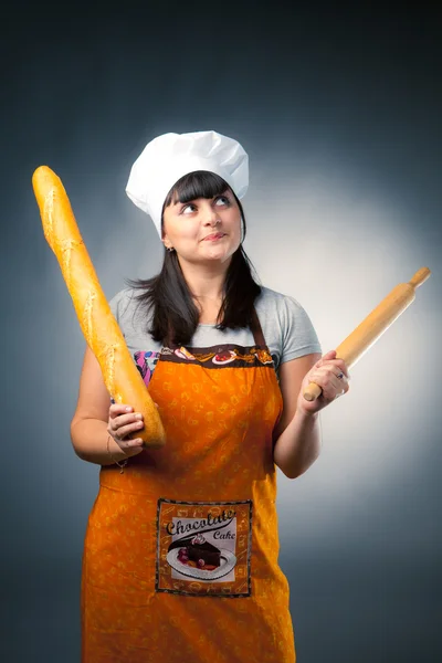 Woman cook with bread and rolling-pin — Stock Photo, Image