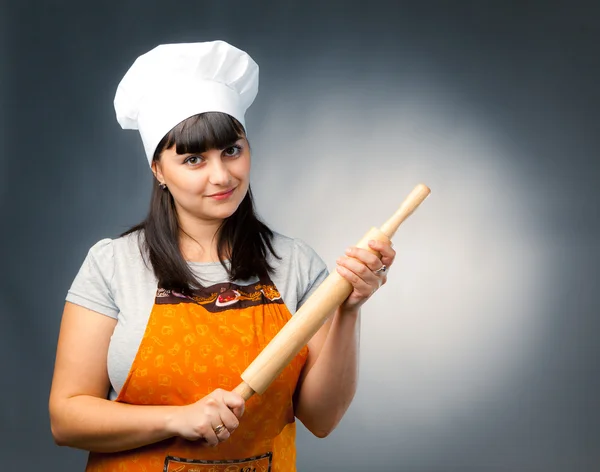 Woman cook holding a rolling pin — Stock Photo, Image