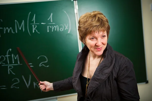 Smiling teacher with pointer — Stock Photo, Image