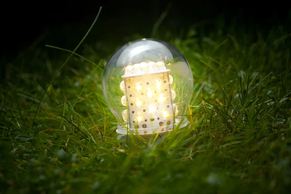 Led lamp on the grass — Stock Photo, Image