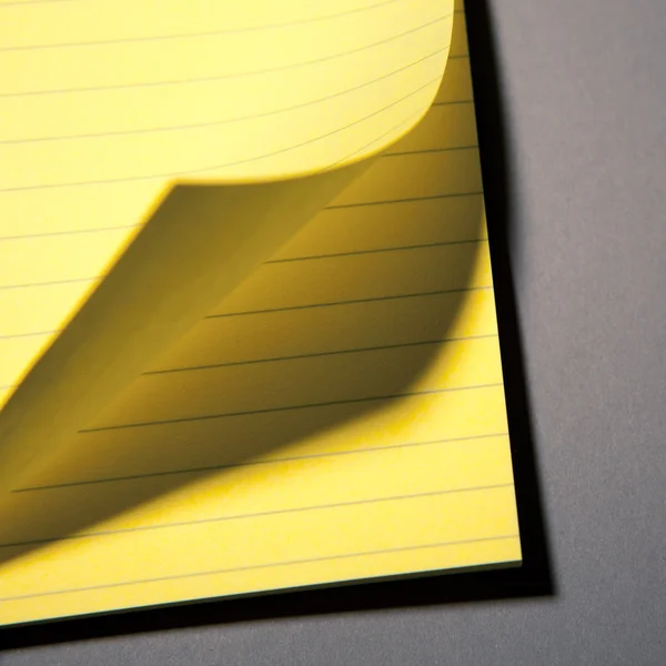 Yellow paper page peel