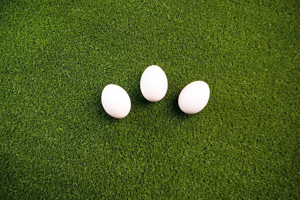 Group of eggs on the green lawn — Stock Photo, Image