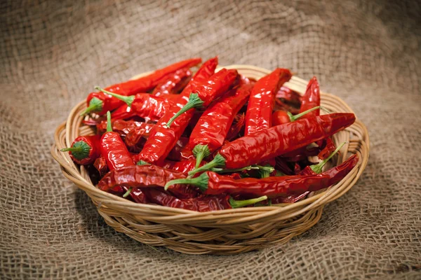 stock image Red chili peppers on the wicker dish