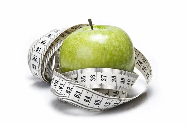 Ruban à mesurer et pomme . — Photo