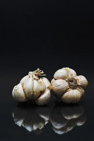 Garlic over black background. — Stock Photo, Image