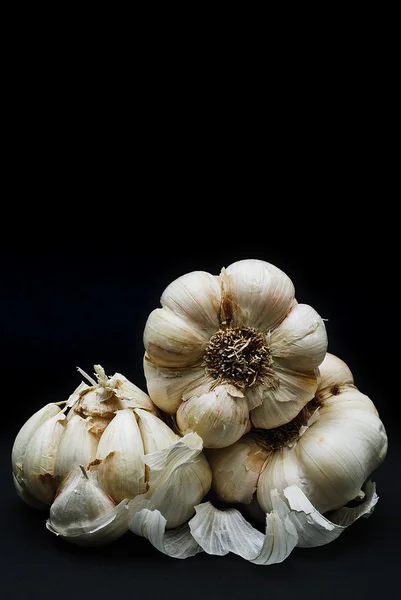 Garlic over black background. — Stock Photo, Image