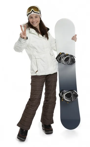Mujer sosteniendo snowboard en blanco Imagen de stock