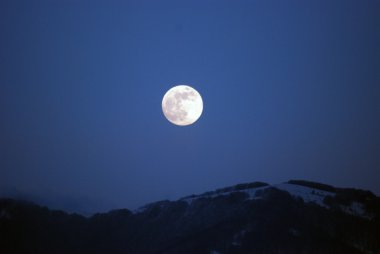 Full moon over the mountains clipart