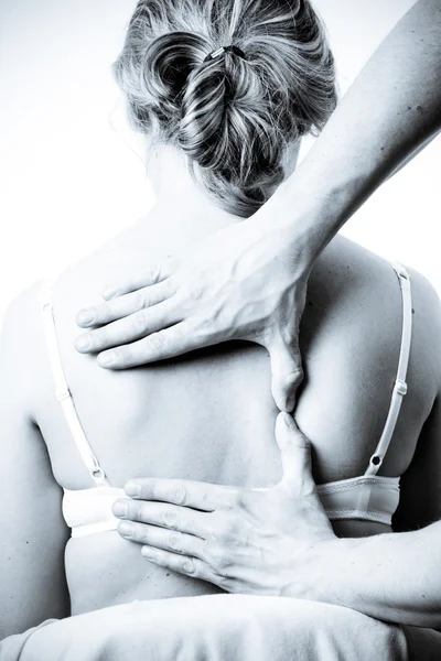 stock image Massage therapist giving a massage. female receiving professiona
