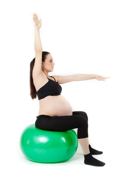 Bal に分離運動に座って美しい妊娠中の女性 — ストック写真