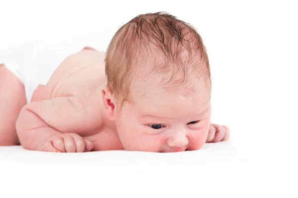 Ένα μωρό μιας εβδομάδας αγόρι σε λευκό. — Φωτογραφία Αρχείου
