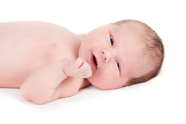 Ένα μωρό μιας εβδομάδας αγόρι σε λευκό. — Φωτογραφία Αρχείου