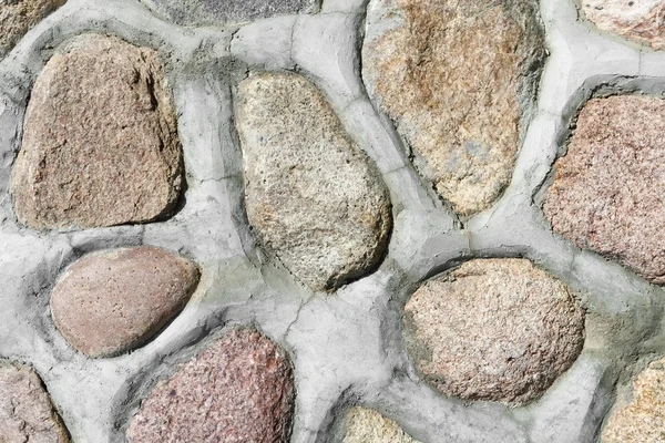 Rode granieten stenen in muur — Stockfoto