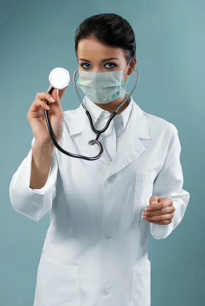 Pretty doctor examining with stethoscope — Stock Photo, Image