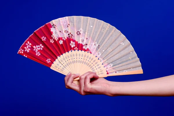 Hanging on to japanese fan — Stock Photo, Image