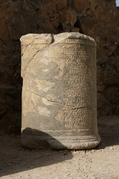 Column with inscription in Lindos — Stock Photo, Image