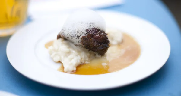 stock image Glazed cheek of Iberian pork in sherry and cream with rice and m