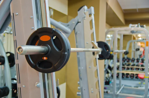 Photo of barbell in training room — Stock Photo, Image
