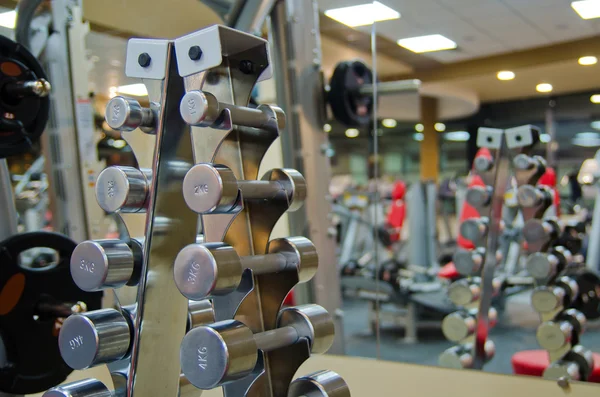 A set of dumbbells on the rack — Stock Photo, Image