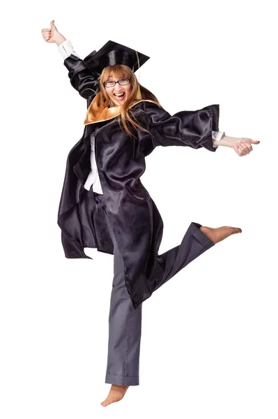 Female graduate jumping and smiling — Stock Photo, Image