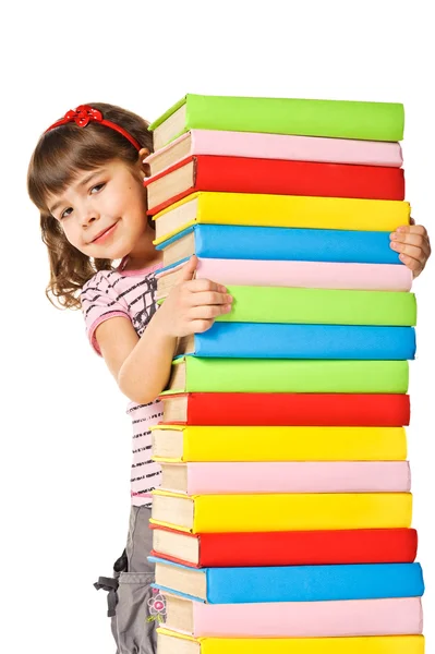 Happy Schoolgirl holding pile of books — Stock Photo, Image