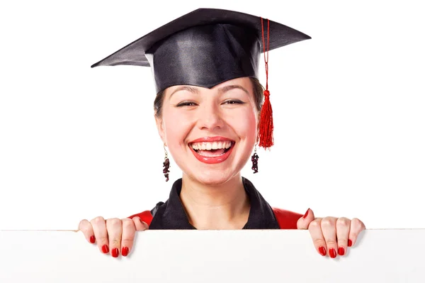 Portrait of a graduating woman holding a display for text — Stock Photo, Image
