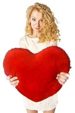 Attractive young woman holding heart