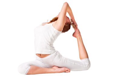 Young yoga female doing yogatic exericis clipart