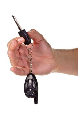 Hand holding car keys and a remote control clipart