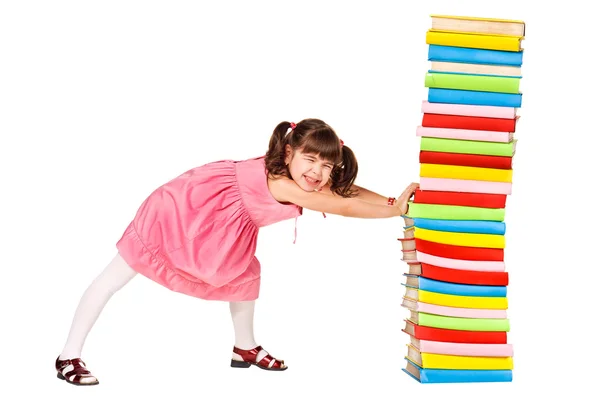 Little schoolgirl push a stack of heavy books — Stock Photo, Image