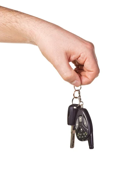 Mão segurando a chave do carro e controle remoto — Fotografia de Stock