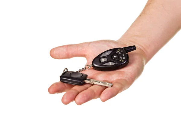 Mão segurando chave do carro e fob entrada remota — Fotografia de Stock
