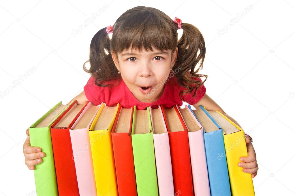 Happy little girl holding pile of books