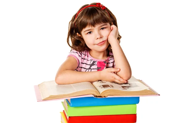 Chica cansada sosteniendo pila de libros — Foto de Stock