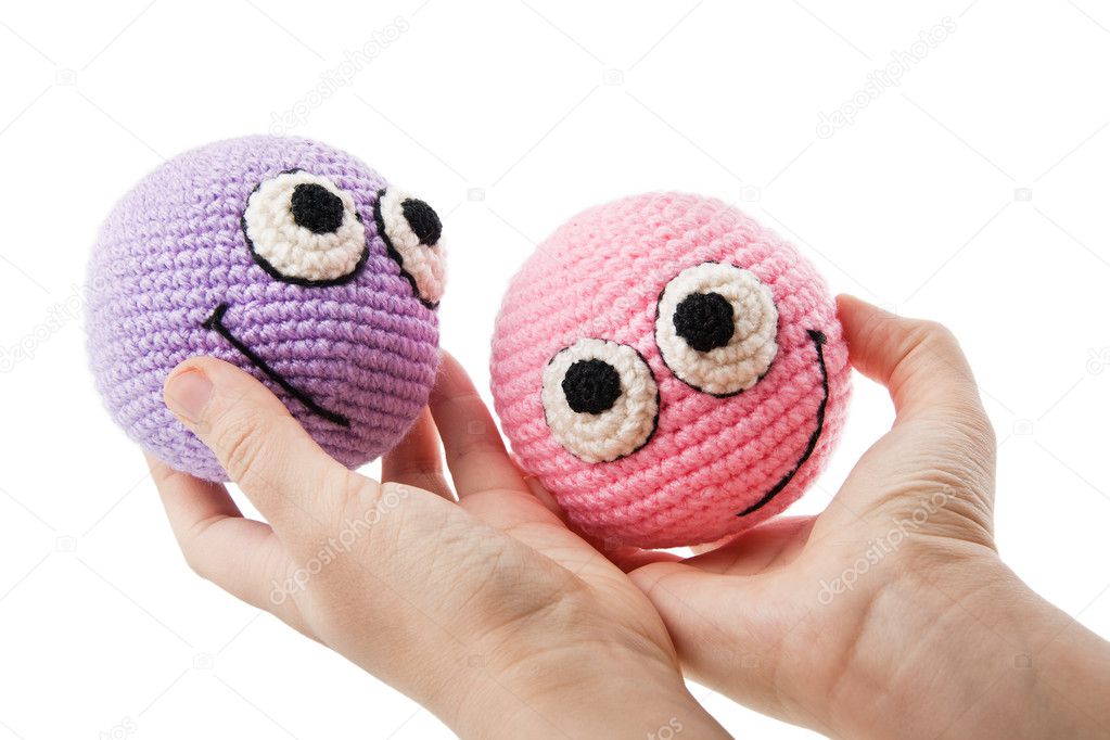 Two pretty smileys in woman hands