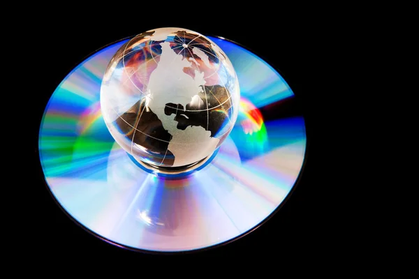 Earth globe op compact disk — Stockfoto