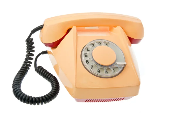 Старый серо-желтый с красным телефоном — стоковое фото