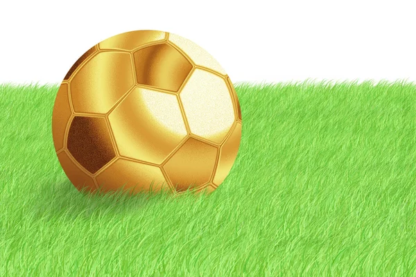 Golden football ball on green grass — Stock Photo, Image