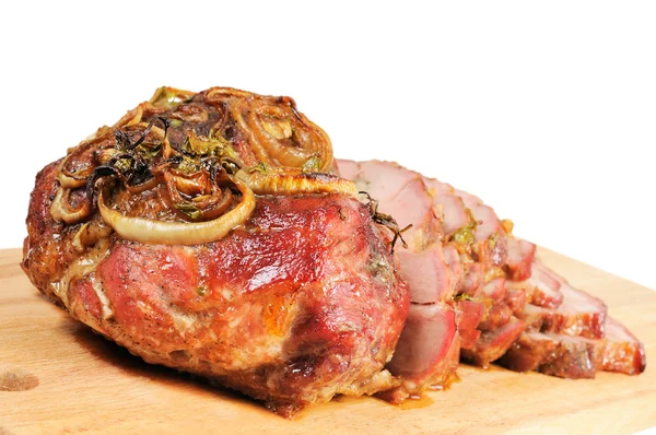 Roast pork on a wooden board — Stock Photo, Image